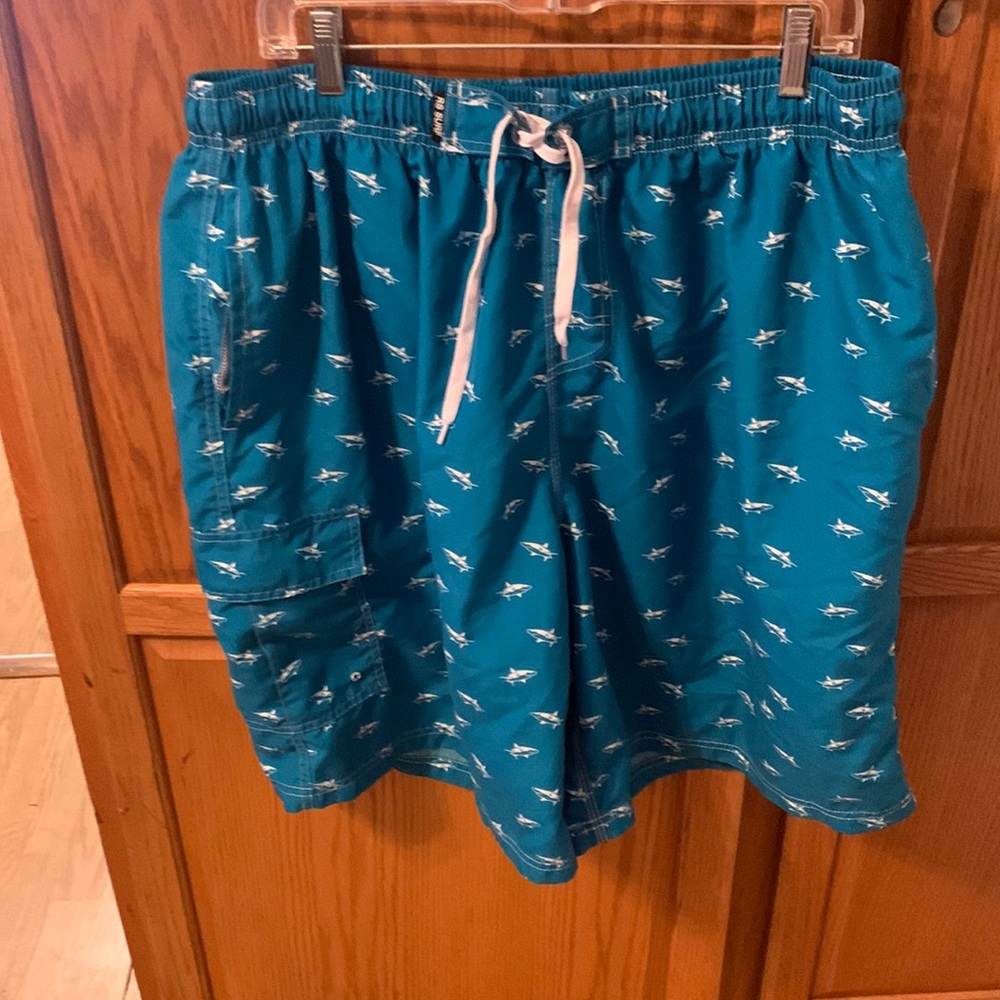 Gently used men’s swim trunks size  3X. Shark pattern